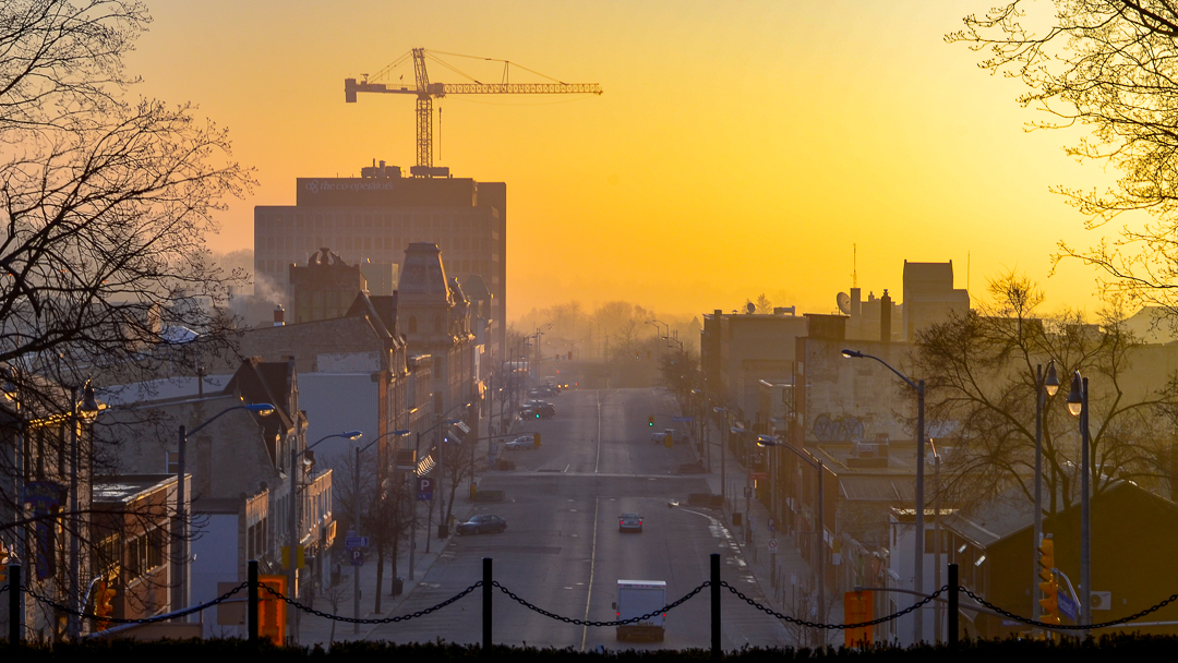 Dawn view from Basilica of Our Lady Immaculate looking down Macdonell Street toward the RiverHouse condo construction crane in Downtown Guelph.