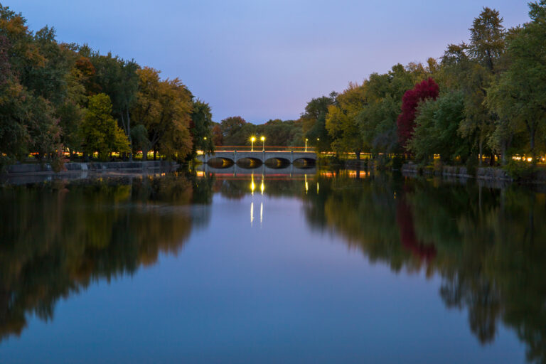 Calm waters along the speed river in Guelph signify the calm before the storm that the arrival of students bring to guelph's energy.