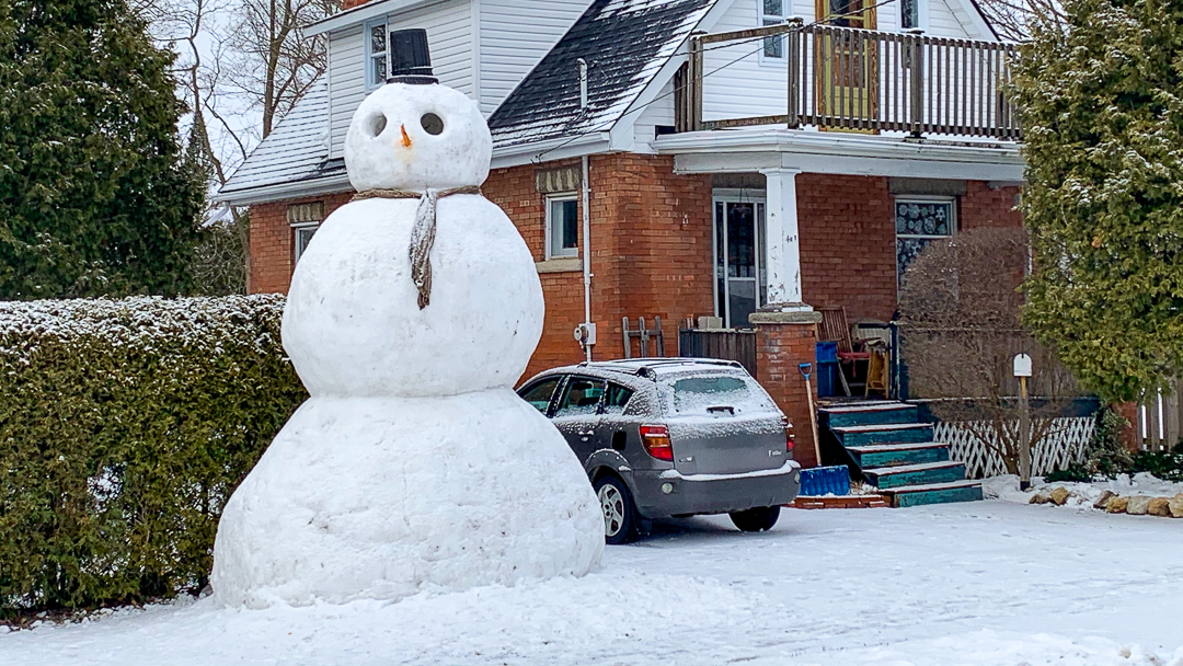 A Quirkly Snowman keeps watch over Glasgow Street in Guelph Ontario